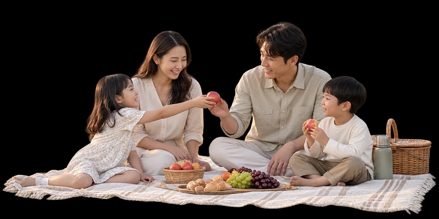 들판에서 함께 피크닉을 즐기는 가족 네 명